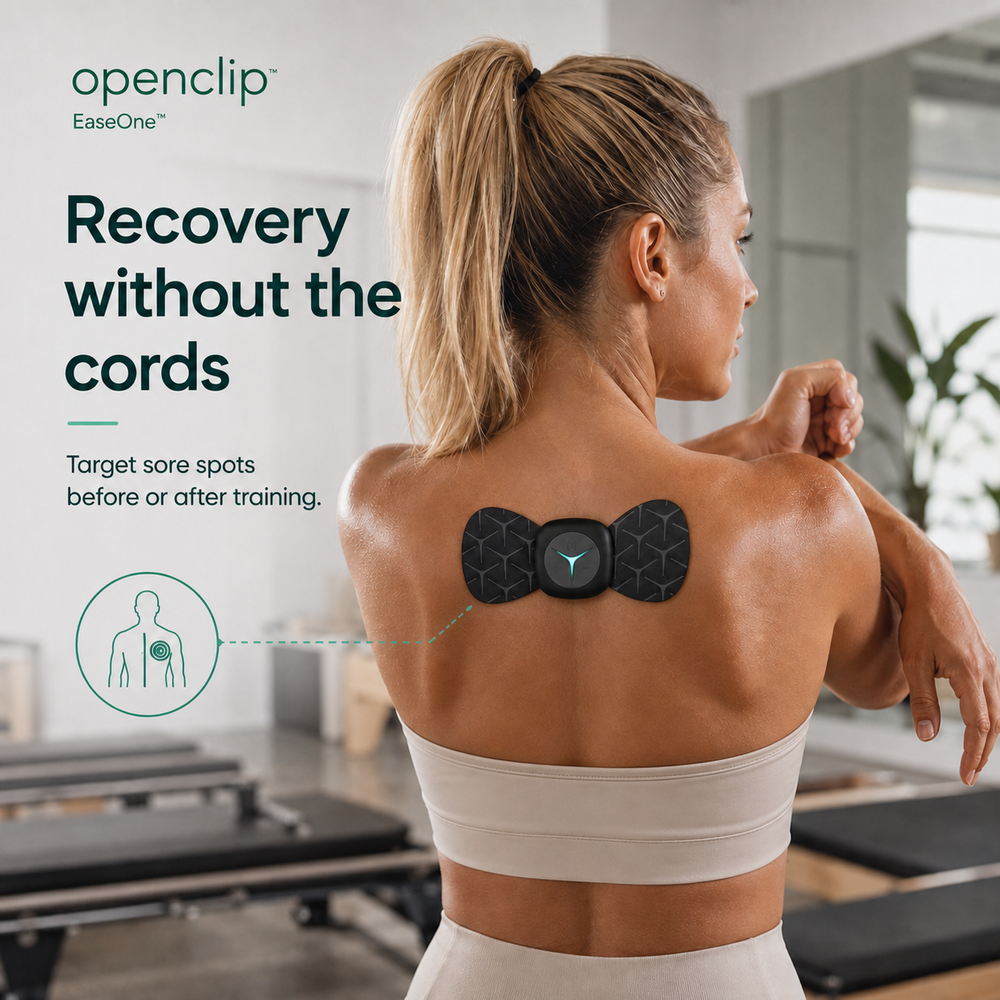 OpenClip Ease wireless massager worn directly on the upper back after training