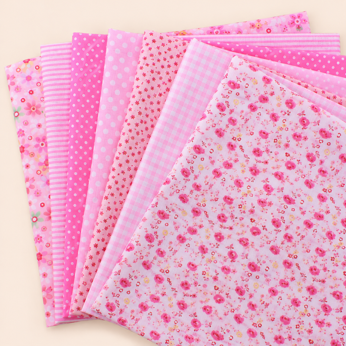 Pink 2 cotton fabric bundle — seven 25 cm squares on cream