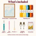Kit contents shown in separate labelled panels: framed printed fabric, matching yarn, punch needle, yarn needle, threader, two hanging fittings and instructions
