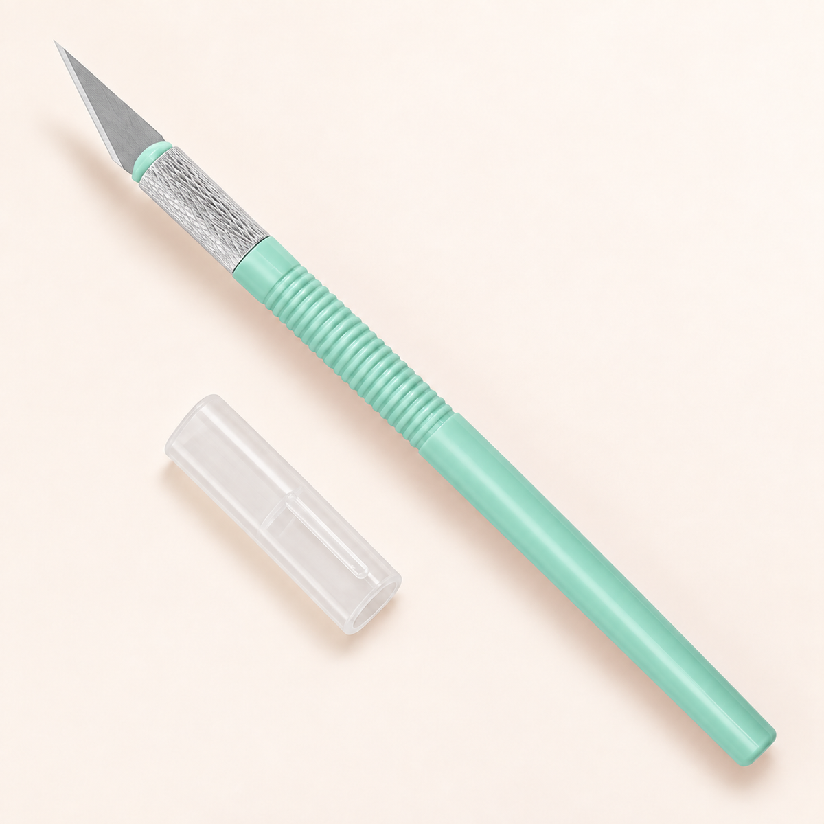Mint green precision craft knife with fitted blade and protective cap