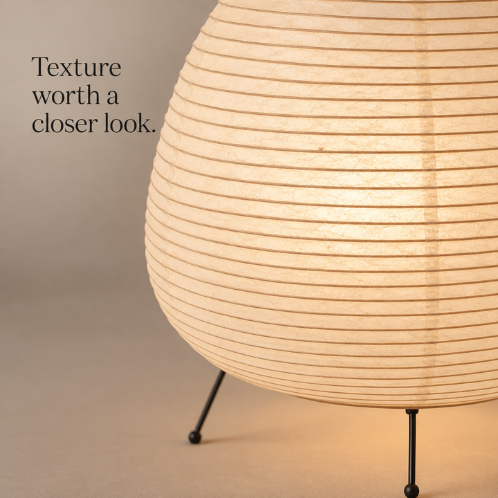 Close view of the paper shade and black tripod frame